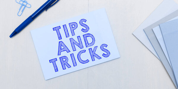 Writing displaying text Tips And Tricks, Word Written on helpful advices that makes certain action easier to do