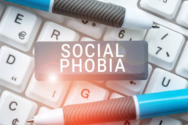 Hand writing sign Social Phobia, Business approach overwhelming fear of social situations that are distressing