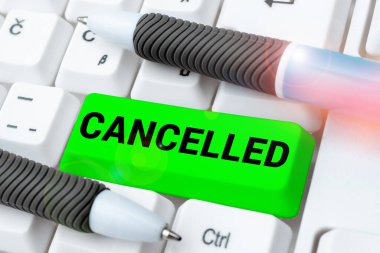 Hand writing sign Cancelled, Business idea decide or announce that planned event will not take place