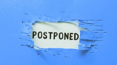 Inspiration showing sign Postponed, Word for to place later in order of precedence, preference, or importance