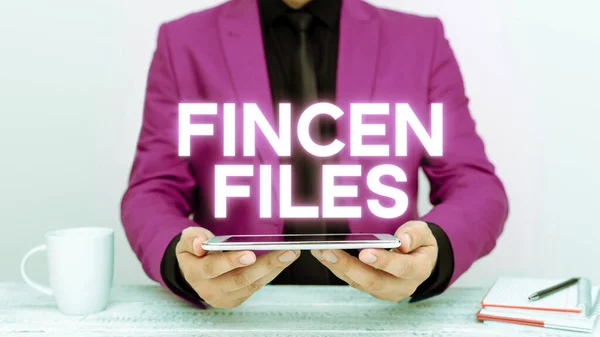 签署显示金融资产和负债中的Fincen Files Word Transactions Financial Assets Liabilities的文件 — 图库照片