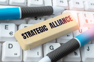 Writing displaying text Strategic Alliance, Conceptual photo a bond between states, parties, individuals on goal achievement