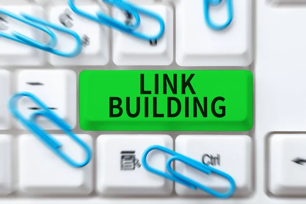 Hand writing sign Link Building, Word Written on SEO Term Exchange Links Acquire Hyperlinks Indexed