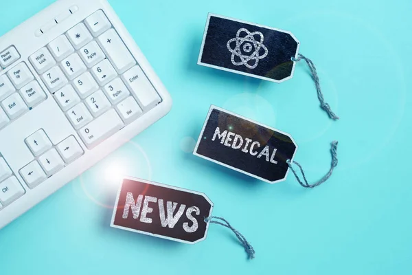 Writing displaying text Medical News, Internet Concept report or noteworthy information on medical breakthrough