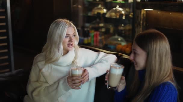 Two Women Sofa Having Relaxed Conversation Drinking Cappuccino — Vídeos de Stock