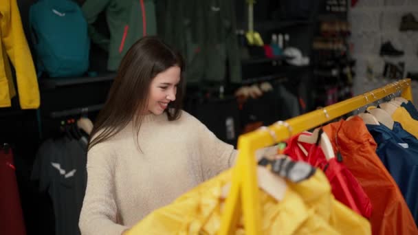 Woman Shopping Mall Choosing Sportswear Rack — Video