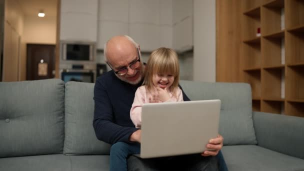 Grandfather Small Granddaughter Having Video Call Together Using Laptop — Stockvideo