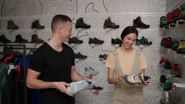 Couple Choosing New Shoes Together Woman Holds New Sneakers — Vídeo de Stock