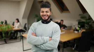 Happy confident handsome smart young adult entrepreneur, leader, manager posing in office.