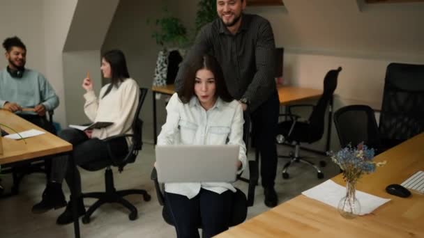 Cheerful Employee Pushes His Female Colleague Chair Laptop Knees — Stockvideo