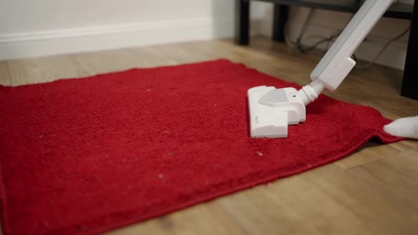 Person Vacuums Floor Removes Dust Dirt Red Carpet — Vídeos de Stock