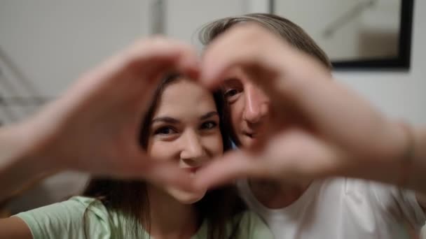 Couple Faces Looking Joined Fingers Making Heart Shape — Stock Video