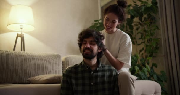 Woman Massaging Head Her Man Living Room Home — Stock Video