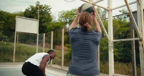 Red Haired Man Gray Shirt Scores Goal Basketball Hoop Rejoices — Stock Video