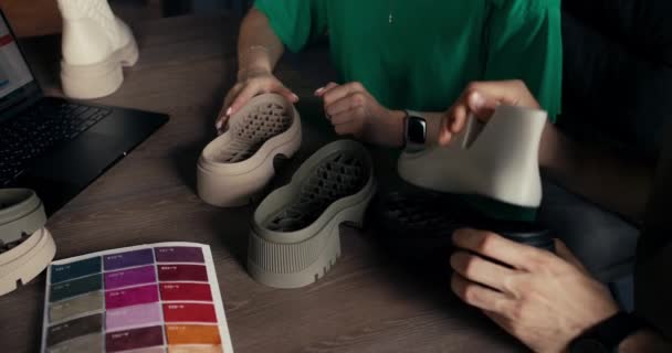 Close Shoe Managers Examining Outsole New Product Overview Color Material — Stock video