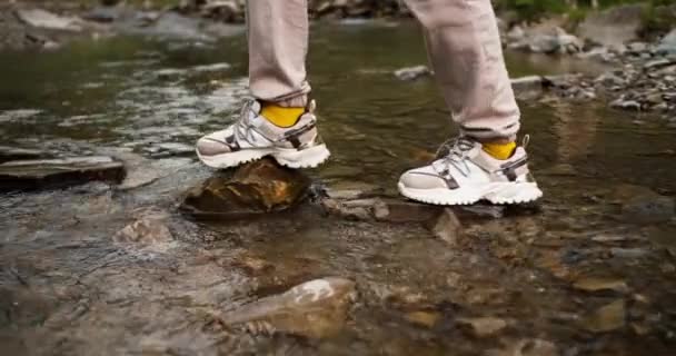 Shooting Close Girl White Sneakers Crosses Mountain River Special Path — Stock Video
