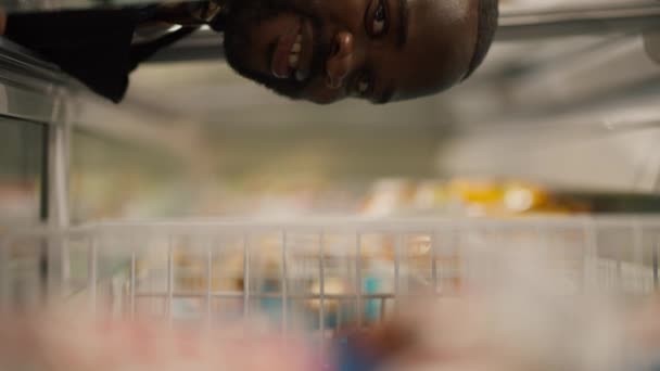Close Shot Black Skinned Man Plaid Shirt Looks Supermarket Refrigerator — Stock Video