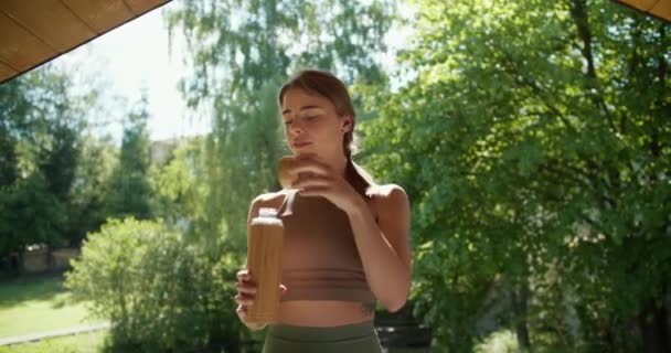 Blonde Girl Light Brown Shirt Opens Special Thermos Drinks Water — Stock Video