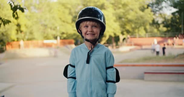 Portrait Happy Blond Boy Blue Jacket Black Helmet Elbow Pads — Stock Video
