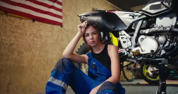 Portrait Tired Brunette Girl Auto Mechanic Black Top Blue Overalls — Stock Video