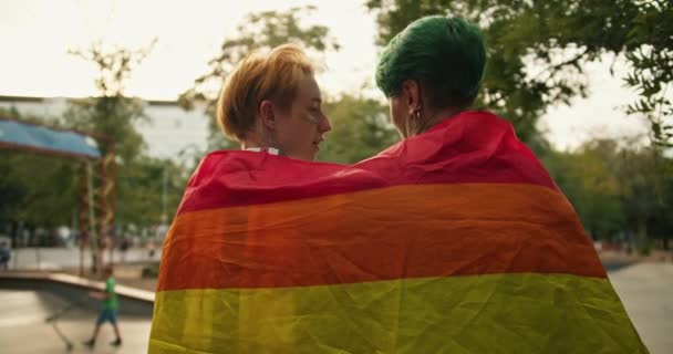 Two Lesbian Girls Sit Fence Covered Lgbt Flag Communicate Each — Stock Video