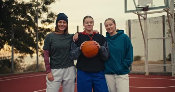 Portrait Trio Happy Girls Basketball Players Blondes Hoodies Holding Orange — Stock Video