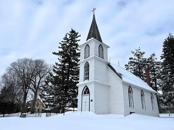 This old country church with a fresh new bed of snow