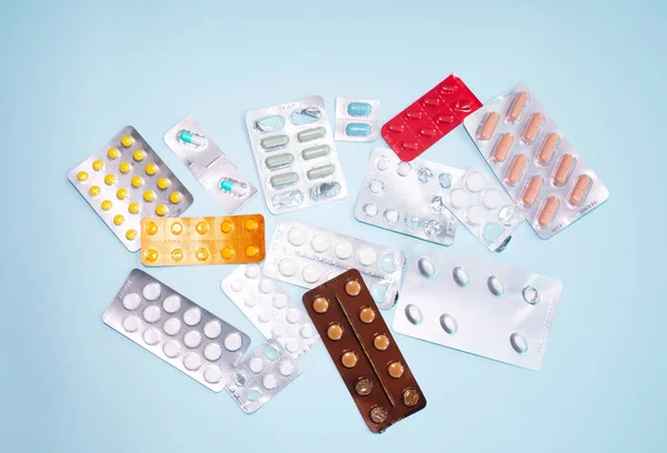 Close View Scattered Blister Packs Different Pills Blue Background — Stockfoto