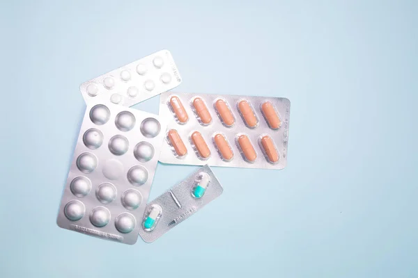 Close View Scattered Blister Packs Different Pills Blue Background — Stock Photo, Image