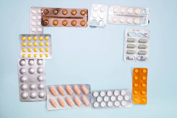 Close View Scattered Blister Packs Different Pills Blue Background — Stockfoto