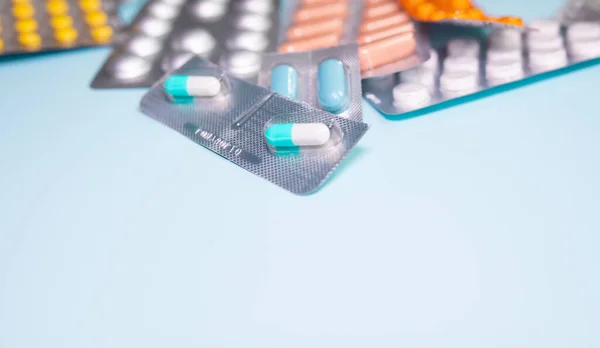 Close View Scattered Blister Packs Different Pills Blue Background — Stock fotografie