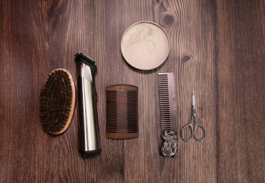 Different combs, brushes and other tools for grooming a beard. Close up view. 