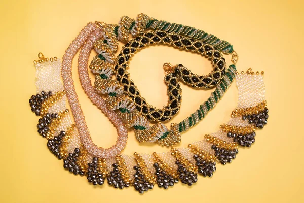 Beads, Jewelry, beads necklaces on yellow background