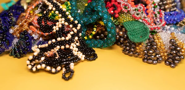 Beads, Jewelry, beads necklaces on yellow background