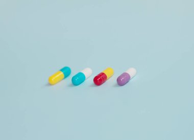 pharmaceutical medicine pills, tablets and capsules on blue background. Medicine concept.  