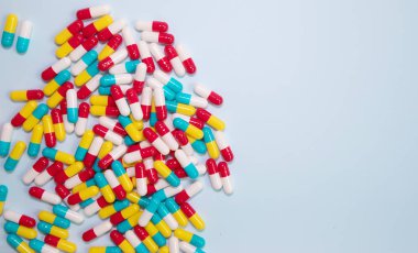 pharmaceutical medicine pills, tablets and capsules on blue background. Medicine concept.  