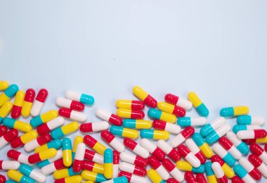 pharmaceutical medicine pills, tablets and capsules on blue background. Medicine concept.  