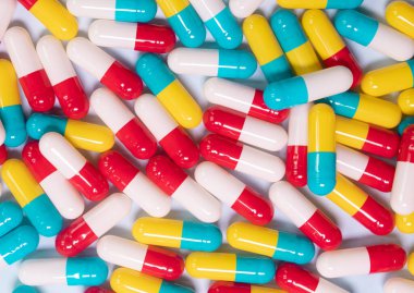 pharmaceutical medicine pills, tablets and capsules on blue background. Medicine concept.  