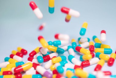 pharmaceutical medicine pills, tablets and capsules on blue background. Medicine concept.  