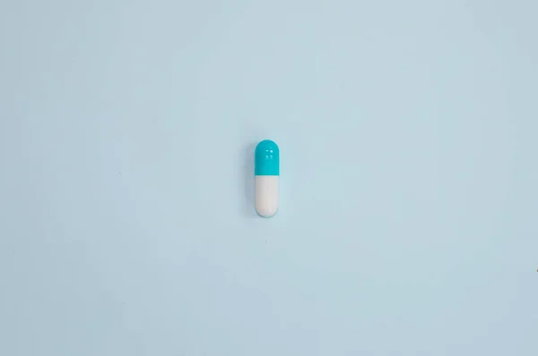Top View Medical Capsule Blue Background — Stock fotografie