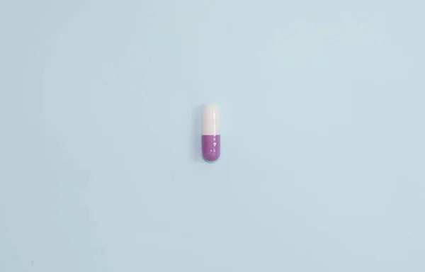Top View Medical Capsule Blue Background — Stock fotografie
