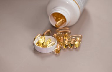 Oil filled capsules of food supplements: fish oil, omega 3, omega 6, omega 9, vitamin A, vitamin D3, vitamin E, borage oil. 