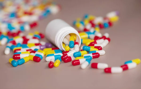 Pills on beige background. Medicines and prescription pills background