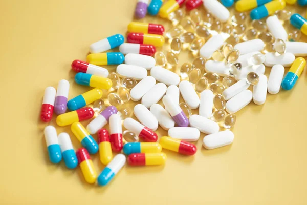 Many Colorful Pills Yellow Background — Stock Photo, Image