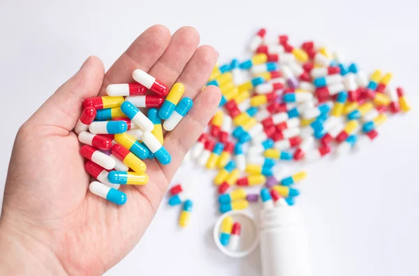 Close Hand Holding Medicine Pills White Table Background — Stock Photo, Image