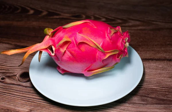 Close-up view of dragon fruit, exotic dragon fruit on wooden table background. Pitahaya.