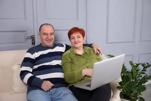 Mid Age Couple Sitting Sofa Working Home Laptop Stock Picture