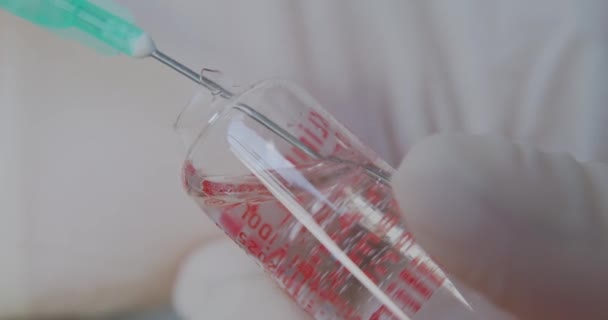 Doctor Dials Antibiotic Glass Ampoule Syringe Macro Shooting Needle Syringe — Stock Video