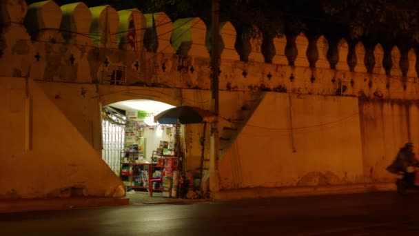 Evening Bustle Illuminated Shop Historical Archway Passing Scooter Una Vista — Vídeo de stock