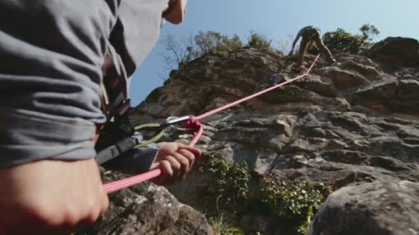 Close View Person Belaying Another Rope Rock Climb Focus Hands — Stock Video